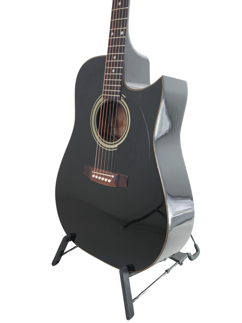 Black acoustic guitar on a stand, showcasing the vintage Maton Tommy Emmanuel 'Ebony' Signature from 1989, Australia.
