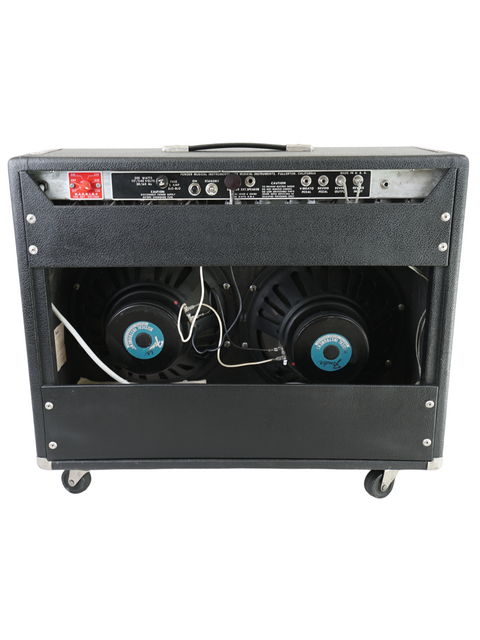 Black amplifier with two speakers on wheels, a 1976 Fender Twin Reverb combo, ideal for musicians on the go.
