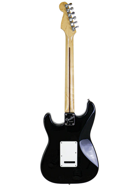 Black electric guitar, Fender Strat Plus Ultra from 1993, featuring a prominent white pickup, highlighting its classic style.