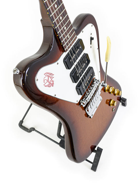 Brown-bodied 1966 Gibson Non Reverse Firebird III guitar with a sleek black headstock.