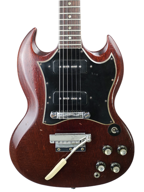 Brown 1967 Gibson SG Special electric guitar featuring a black pickguard, exemplifying vintage American guitar artistry.