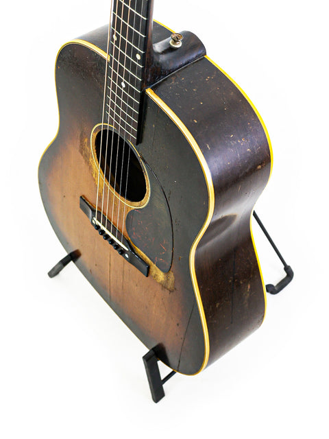 Classic 1940s Gibson J-45 acoustic guitar, vintage 1953 model, celebrated for its warm tone and beautiful craftsmanship.