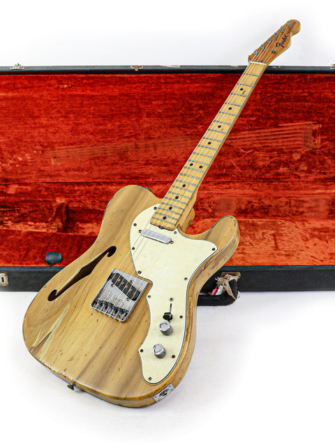  Classic 1971 Fender Telecaster Thinline guitar with a wooden body, resting in a stylish case, perfect for any music lover.