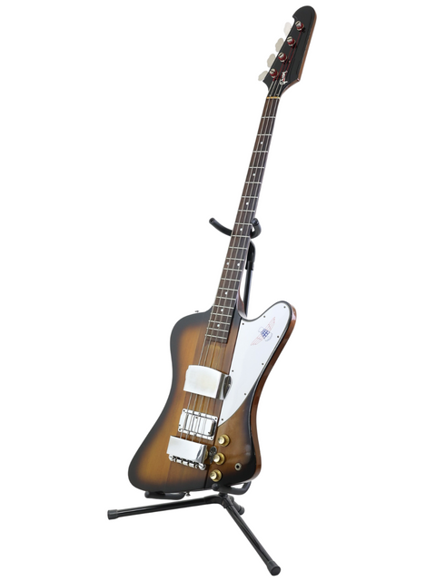 Classic 1976 Gibson Bicentennial Thunderbird IV Bass on a stand, elegantly presented with a white background.
