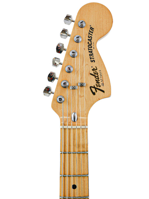 Classic 1977 Fender Stratocaster electric guitar from the USA, known for its sleek body and legendary sound quality.
