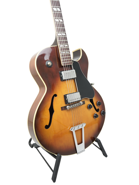 Classic 1986 Gibson ES-175 guitar in sunburst finish, beautifully positioned on a stand for display.