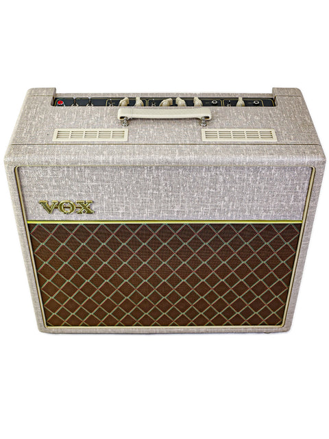 Classic Vox AC-15 HW1X guitar amp in a chic white and brown finish, perfect for any music lover's setup.
