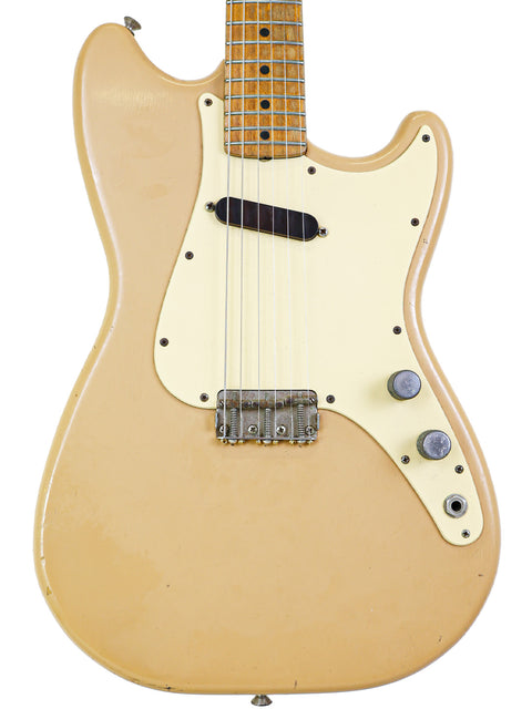 Classic beige electric guitar, a 1957 Fender Musicmaster, complete with a white pickguard.