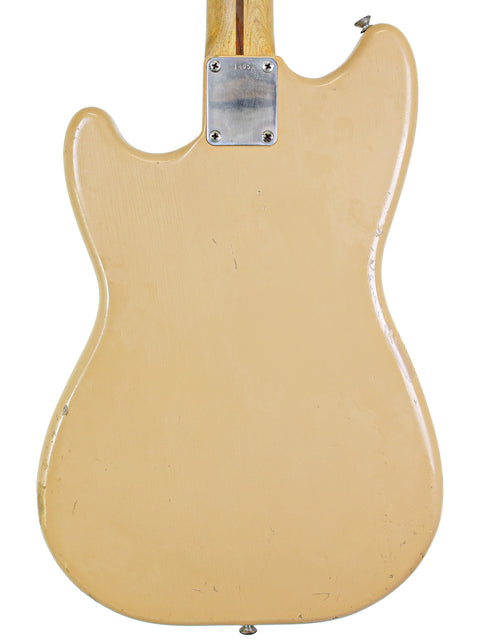 Classic beige electric guitar, a 1957 Fender Musicmaster, with a gorgeous wooden body.