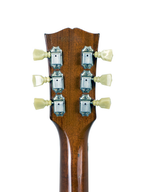 Close-up image of the neck of a 1968 Gibson Les Paul Standard Goldtop, featuring a narrow headstock design.