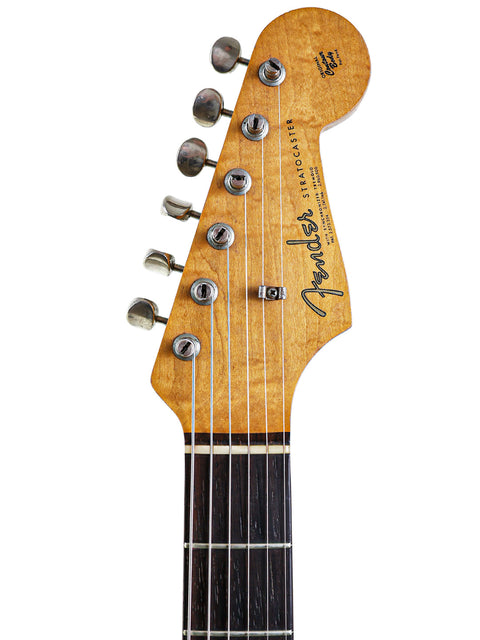 Close-up of a 1963 Fender L-Series Stratocaster guitar, known for its single pickup and timeless vintage appeal.