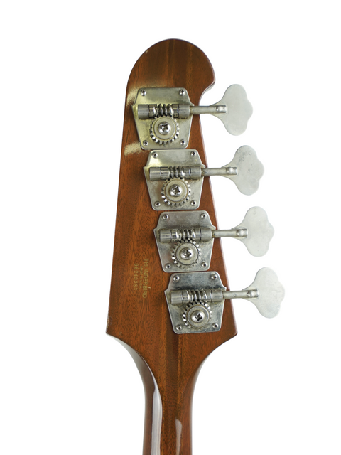  Close-up of a 1976 Gibson Bicentennial Thunderbird IV bass guitar, focusing on its four-string configuration.