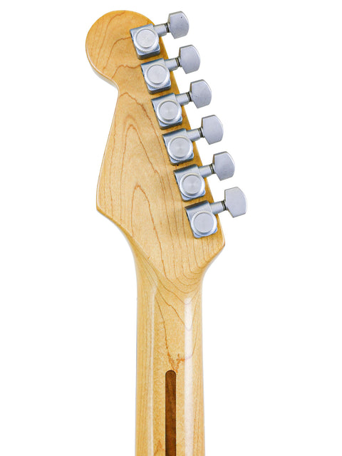 Close-up of a 1989 Fender Strat Plus Deluxe guitar head featuring a wooden body and a metal bridge.