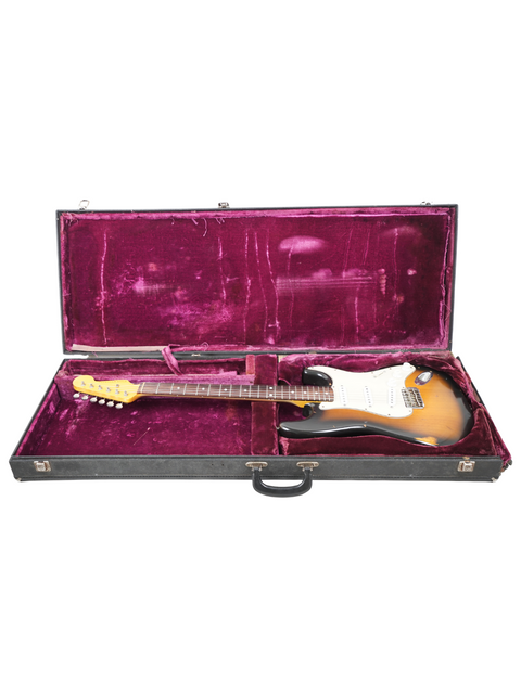 Close-up of a 2009 Nash S63 Stratocaster Relic electric guitar, featuring a worn finish and iconic Stratocaster shape.