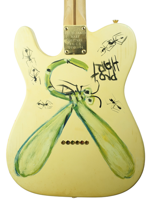 Close-up of a David Hart Pro Hart Telecaster guitar, adorned with a quirky bug illustration, celebrating its 1994 limited edition.