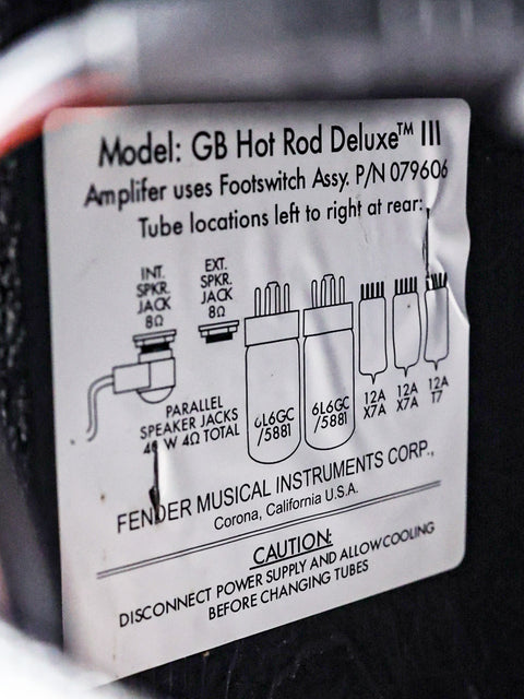 Close-up of a Fender George Benson Hot Rod Deluxe III radio label, showcasing its 2018 USA design and features.