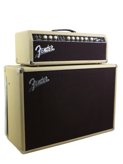 Close-up of a Fender Stratocaster featuring a black and gold head, alongside a classic 1961 Bandmaster amp and cabinet.