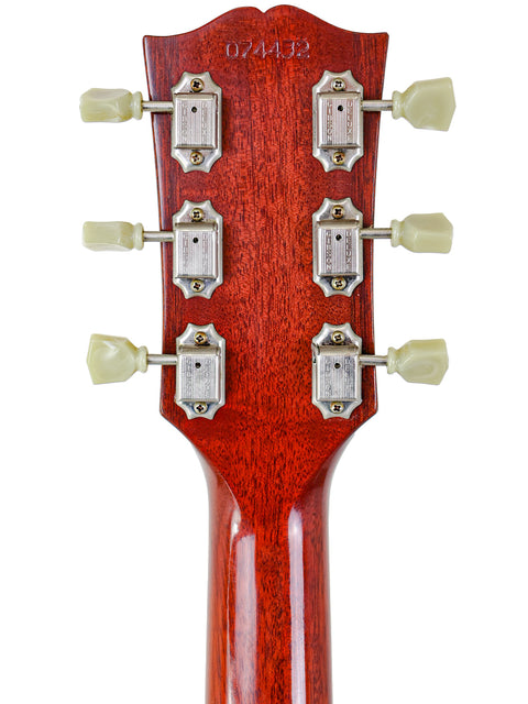 Close-up of a Gibson Custom Les Paul SG Standard M VOS headstock, highlighting four knobs for tone and volume adjustments.