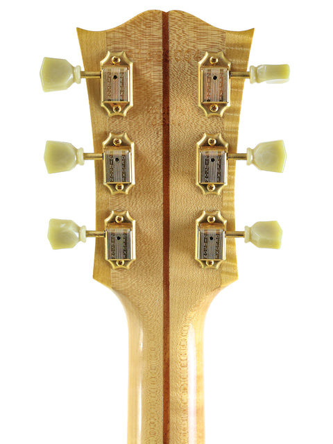 Close-up of a Gibson SJ-200 acoustic guitar neck with four knobs, made in the USA in 1999.