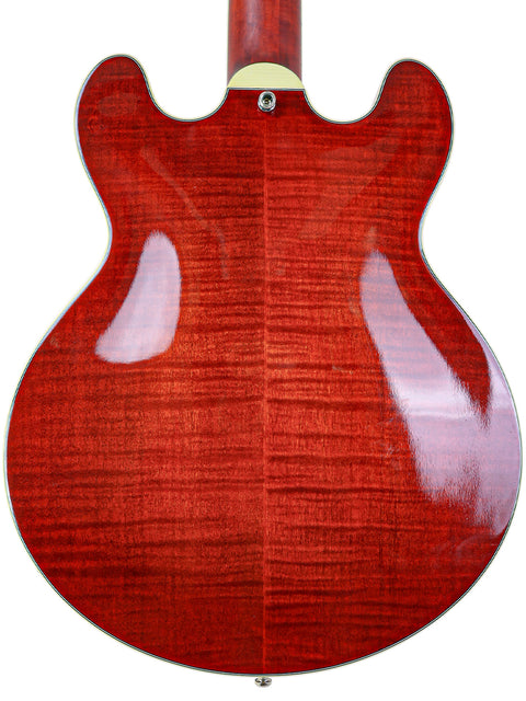 Close-up of a red electric guitar's back with wood grain detail and gloss finish.