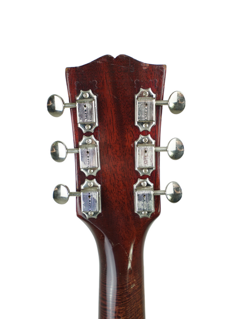 Close-up of a vintage 1967 Gibson SG Special acoustic guitar headstock, showcasing its classic design and craftsmanship.

