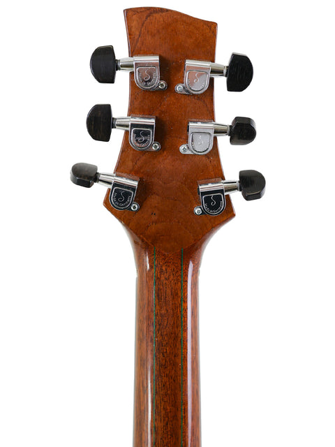 Close-up of an electric guitar neck featuring four knobs, labeled James Cargill Custom, Australia 2015.