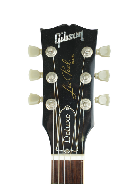 Close-up of the headstock from a Gibson Les Paul Deluxe Limited Edition 30th Anniversary guitar, highlighting its unique features.