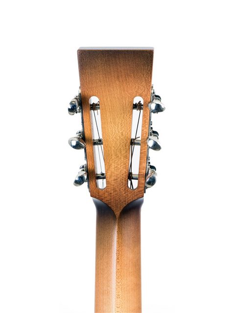 Close-up of the headstock of a 2001 National Resophonic Style N Resonator acoustic guitar, showcasing its intricate design.
