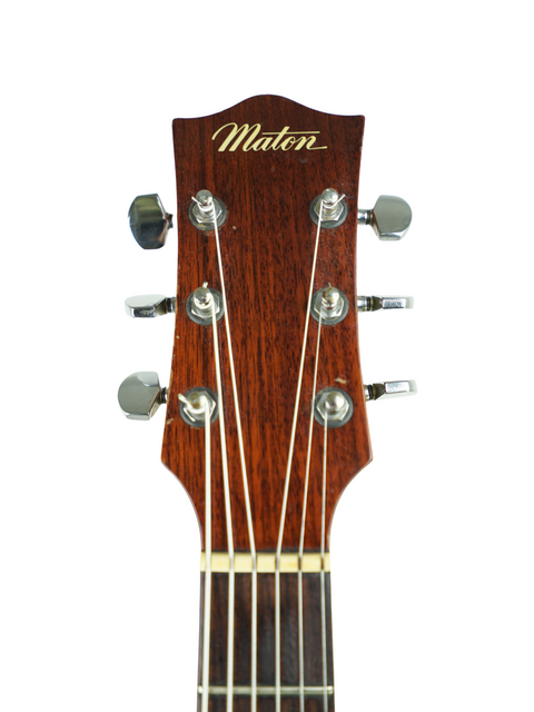 Close-up of the headstock on a 1972 Maton FG100 acoustic guitar, showcasing the "Mikro" logo.
