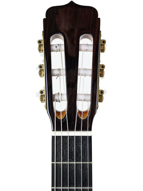 Close-up of the neck of a José Ramírez Estudio 3 Classical guitar, showcasing its craftsmanship and elegant design.