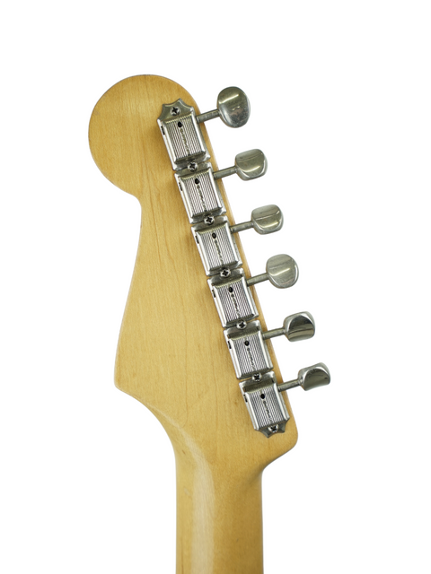 Close-up shot of a 1957 Fender Stratocaster neck, emphasizing its smooth finish and timeless appeal.
