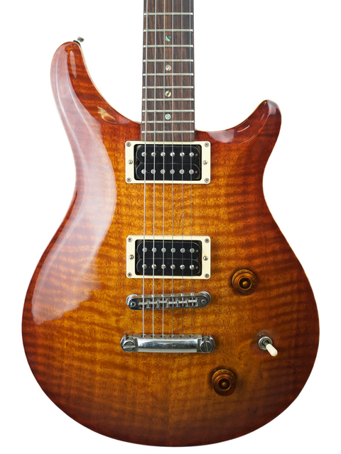 Close-up view of the Belman Double Cut Grand - Aus 2005, showcasing its flamed maple top and dual humbucker pickups.
