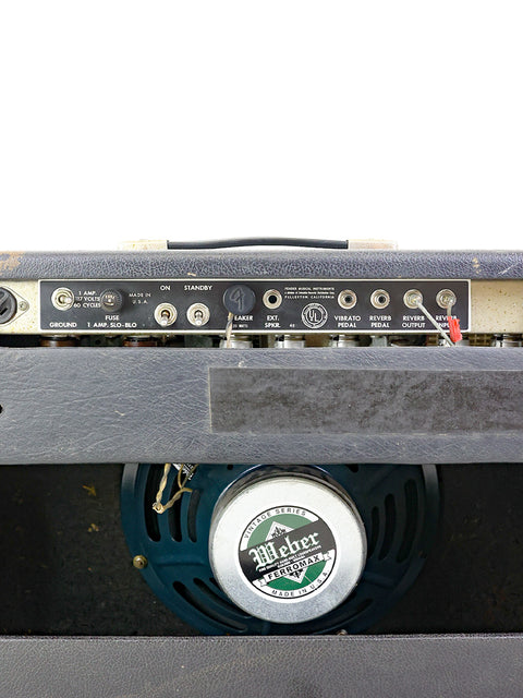 Detailed shot of a 1965 Fender Deluxe Reverb amp, featuring a 12" speaker, highlighting its vintage charm.