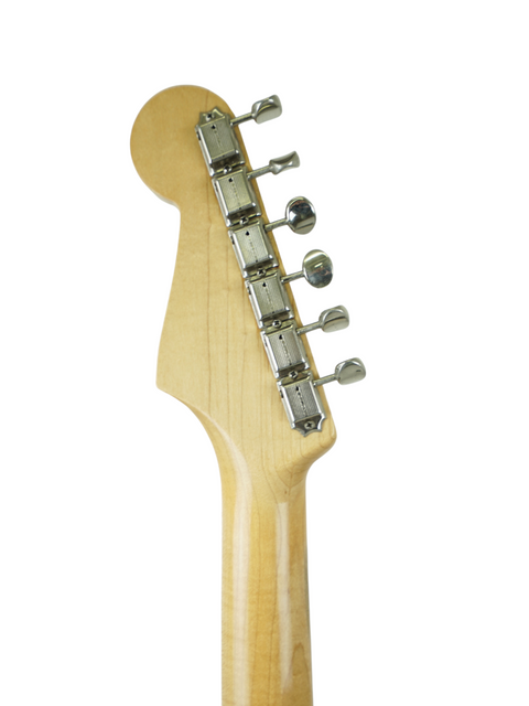 Detailed view of a 1961 Fender Stratocaster guitar head, highlighting its vintage features on a bright white backdrop.