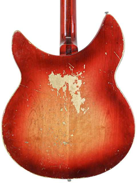 Detailed view of a 1965 Rickenbacker guitar featuring a striking red sunburst finish, highlighting its vintage charm.