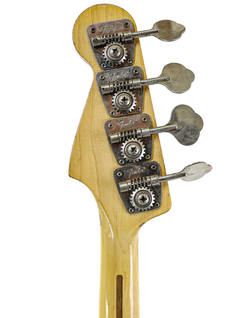 Detailed view of a 1974 USA Fender Jazz Bass, highlighting its four strings and vintage charm.