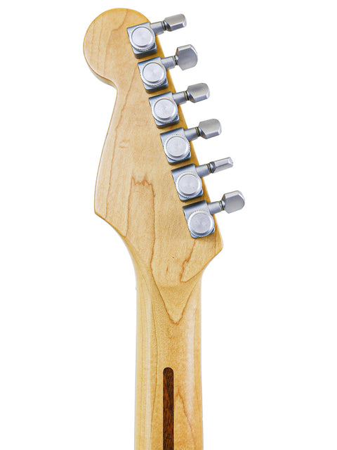 Detailed view of a 1991 Fender Strat Plus guitar head, featuring a white backdrop for emphasis.