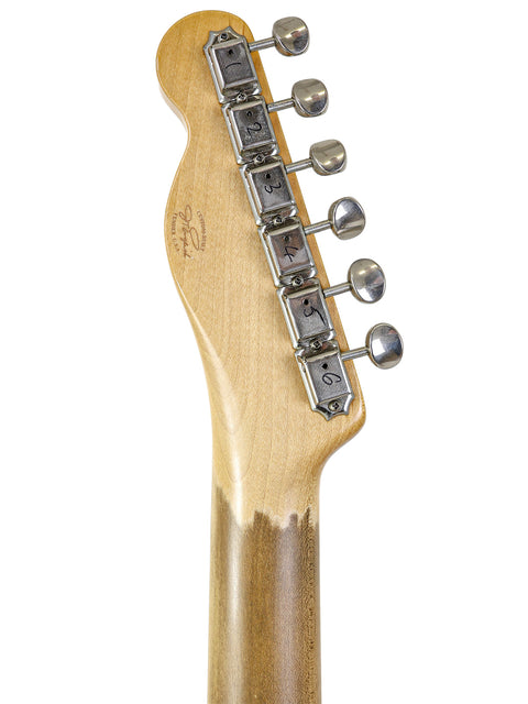  Detailed view of a Fender '59 Custom Telecaster guitar head, highlighting the wooden body and craftsmanship from 2006.
