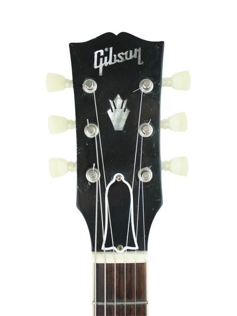 Detailed view of a Gibson headstock from a 2005 ES-335 Block '63 Reissue, highlighting its classic design and craftsmanship.
