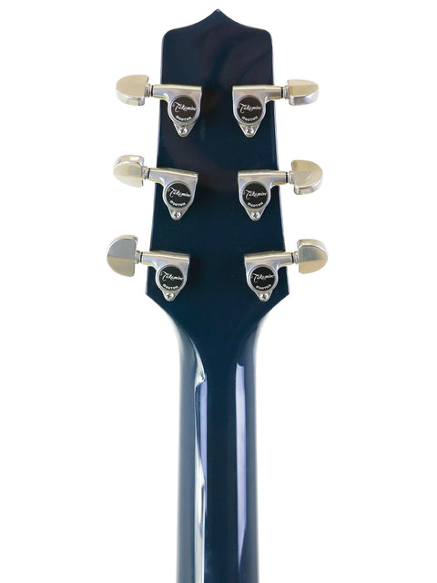 Detailed view of a blue guitar headstock with four knobs, representing the Takamine LTD2021 Limited Edition "Blue Rose" series.