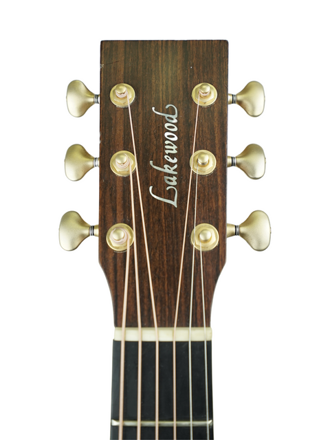 Detailed view of an acoustic guitar headstock with "Lutherwood" branding, showcasing the Lakewood M-NC CP model from 2004.