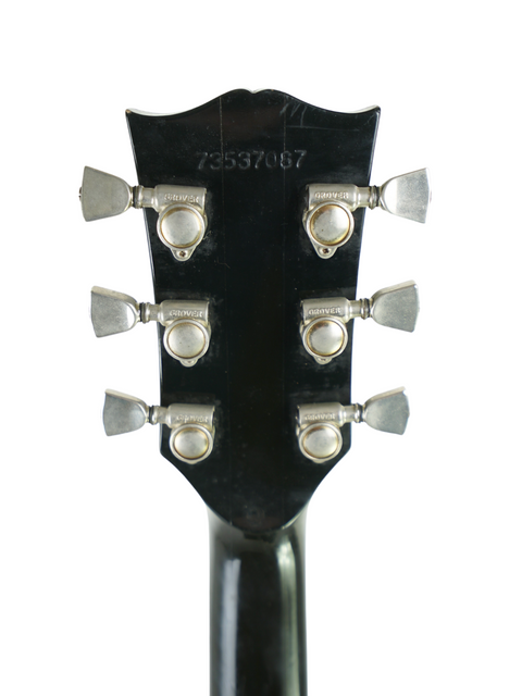 Detailed view of the headstock from a 1977 Vintage Gibson Dove Custom guitar, highlighting its vintage charm and elegance.