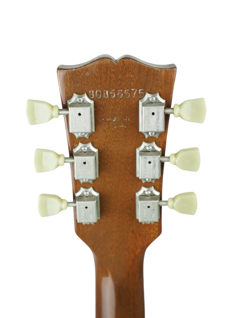 Detailed view of the headstock from a 1986 Vintage Gibson ES-175, showcasing four tuning knobs on this classic guitar.