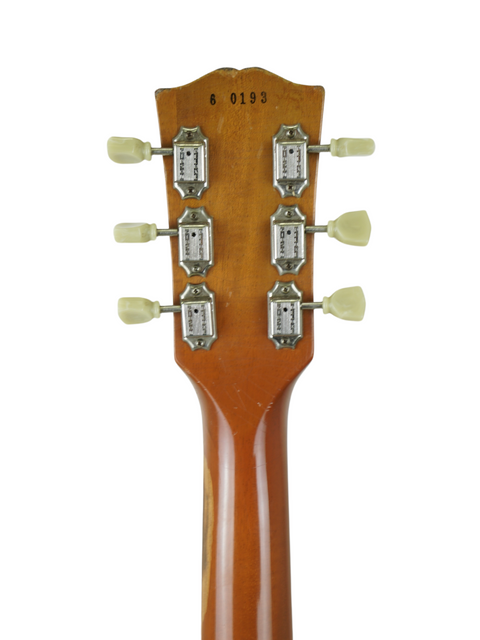 Detailed view of the headstock from a Gibson Custom Shop Les Paul 1956 Reissue, with four prominent knobs.
