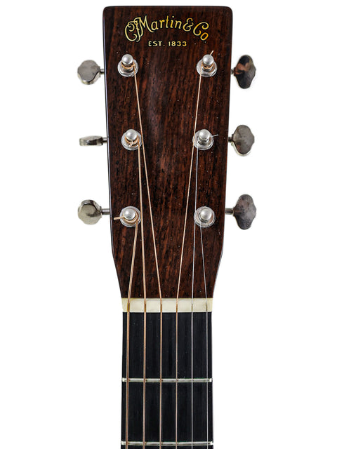 Detailed view of the headstock of a 2006 Martin 000-28EC Eric Clapton Signature acoustic guitar, highlighting its craftsmanship.