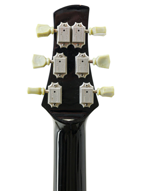 Detailed view of the headstock of an electric guitar, the Orthius Deluxe DC, highlighting its features from Australia, 2018.