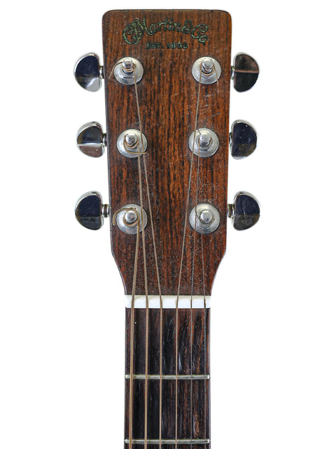 Detailed view of the neck on a vintage 1974 Martin D-18 acoustic guitar, emphasizing its elegant shape and craftsmanship.