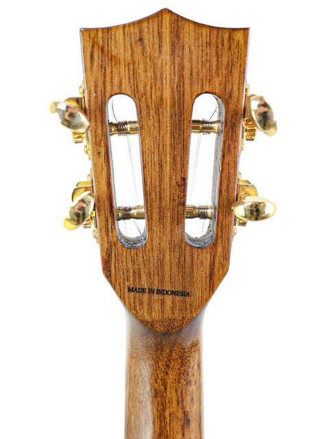 Detailed view of the wooden headstock of the Kala KA-KTGE-C Hawaiian Koa Tenor Ukulele, highlighting its natural beauty.