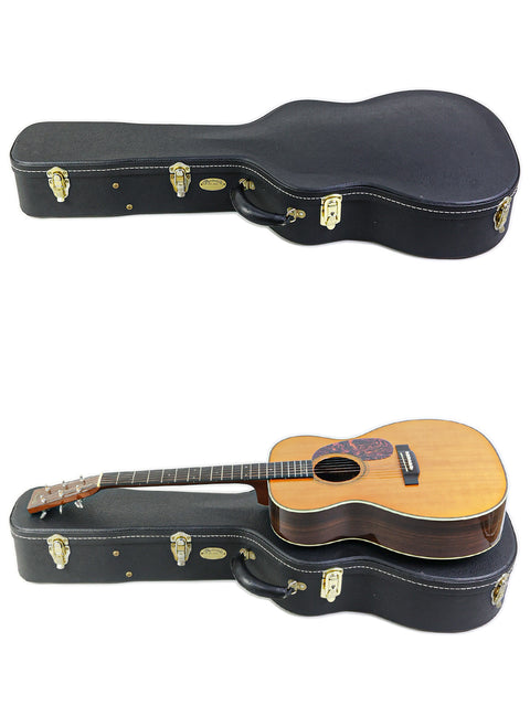 Display of two guitars in distinct orientations, including a 2006 Martin 000-28EC Eric Clapton Signature model.