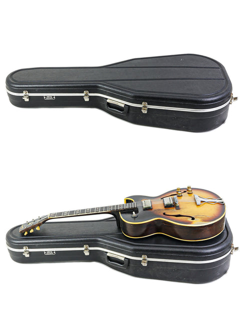 Display of two guitars in varying positions, featuring a vintage Gibson ES-175D from the USA, dated 1962.